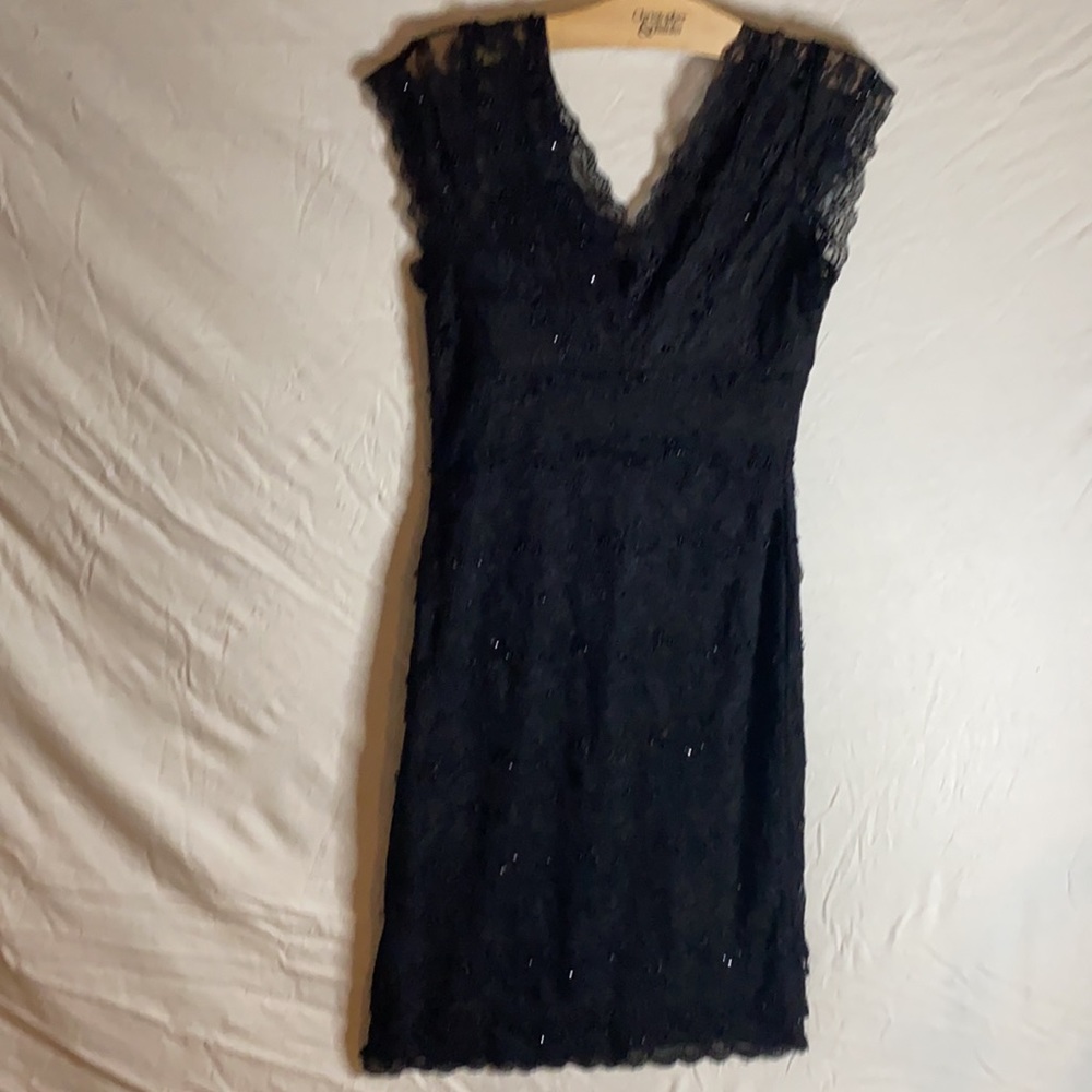 Get noticed in this classic,elegant Marina lacy, sequined black dress!